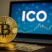 A_digital_photograph_depicts_a_large_golden_Bitcoi ما هو ICO؟